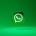WhatsApp icon in a 3D cube, set againts a gradient green background.